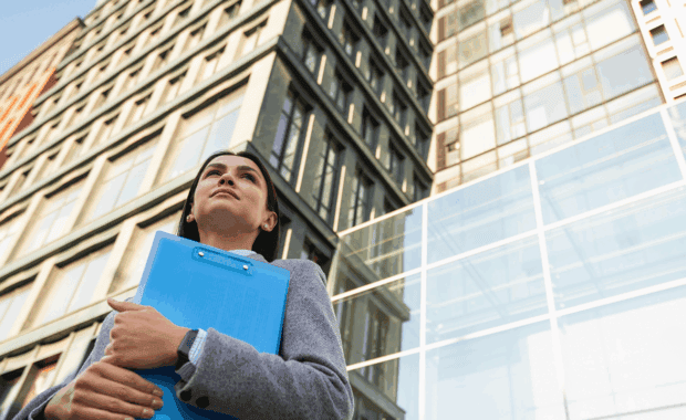 Business woman holding a clipboard
