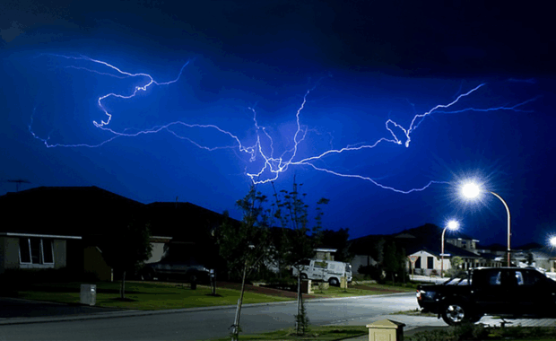Lightning strikes across the dark sky